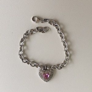 Silver bracelet with pink heart charm.